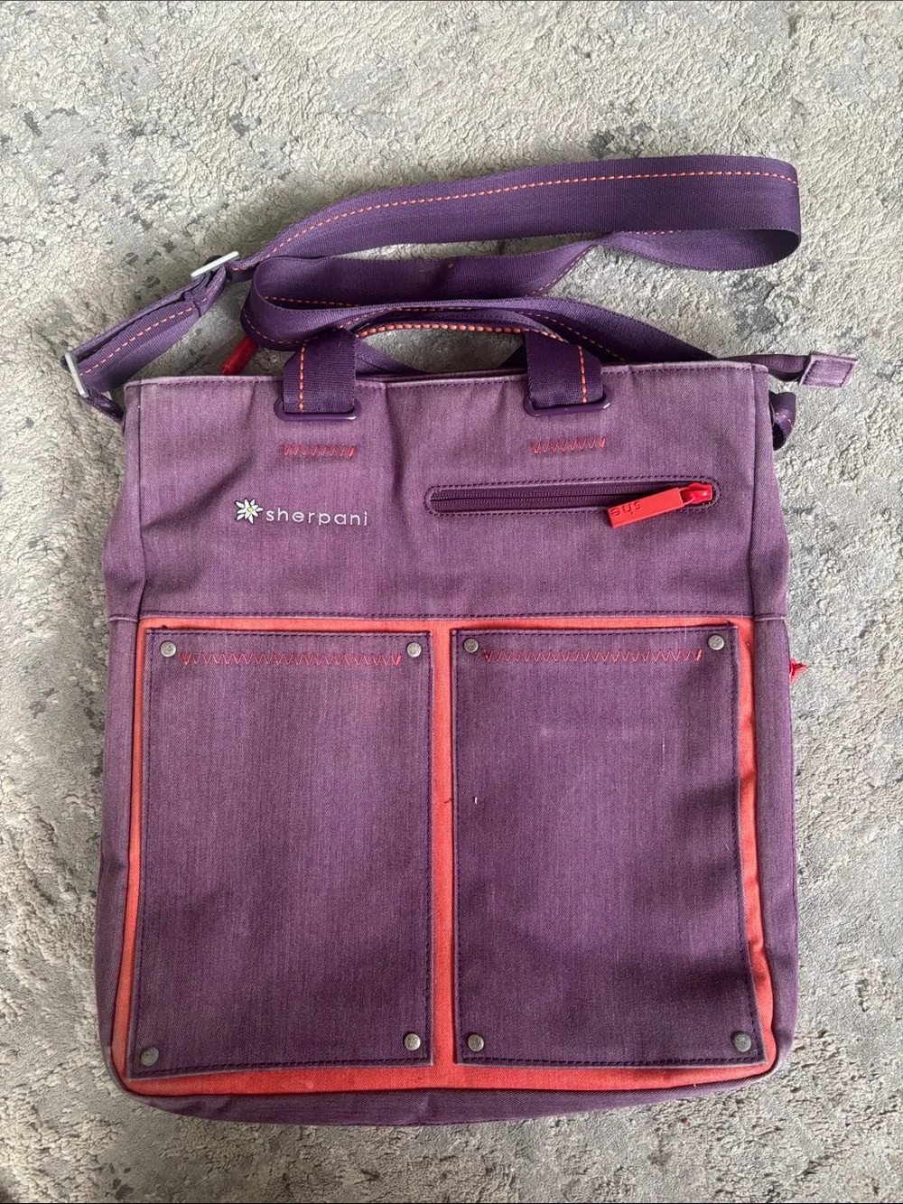 Sherpani purple messenger bag with red trim